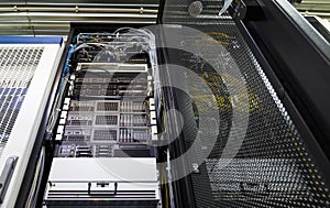 Bottom view of rack server against neon light in datacenter with dept of field