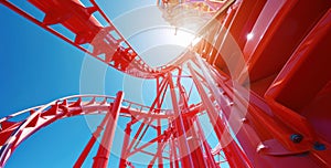 Bottom view of red rides in an amusement park in a sunny bright day