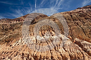 Bottom view of a rocky red cliff