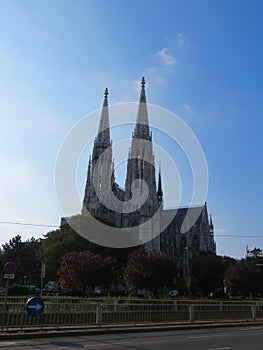 Bottom view shot of a cathedral in Sigmund-Freud Park in Vienna, Austria