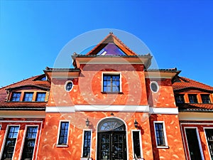 Bottom view shot of a red building in Spa Park in Jelenia GÃ³ra, Poland.