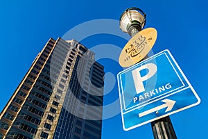 Bottom view of skyscraper and lamppost with signs, Atlanta, USA