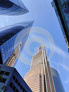 Bottom view on skyscrapers and blue sky. Modern office buildings