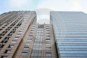 Bottom view at three skyscrapers in Chicago
