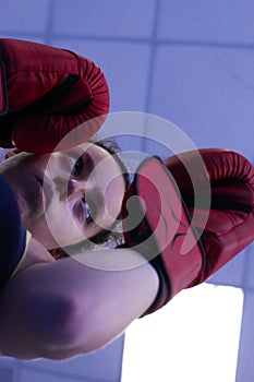 Bottom view of a young girl training boxing