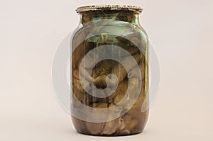 Botulism, food poisoning from canned foods concept. Glass jar wi