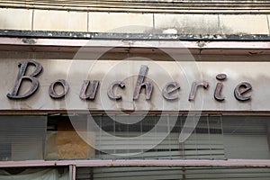 Boucherie store sign old vintage text on retro facade of means french butcher delicatessen shop in france city