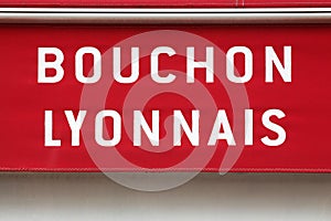 Bouchon Lyonnais restaurant sign on wall