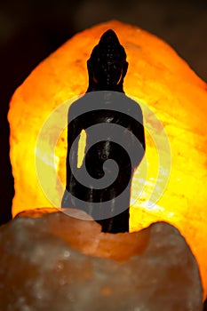 Bouddha and himalayan salt lamp photo