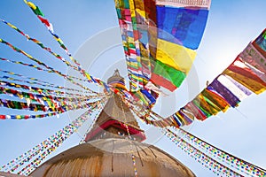 Boudhanath stupa with colorful prayer flags, Buddha eyes and golden mandala in Kathmandu, Nepal, most famous Tibetan buddhism