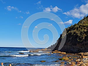 Boudi national park beach with blue clear sky surrounding sea and lots of greenness