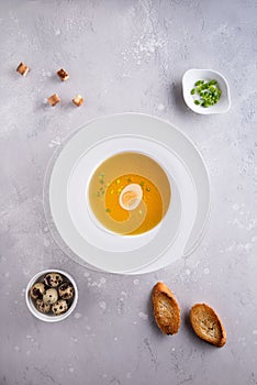 Bouillon with croutons, bread, eggs and scallions