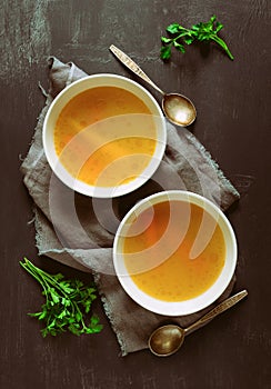 Bouillon served in two bowls photo