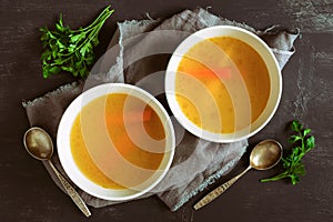 Bouillon served in two bowls photo