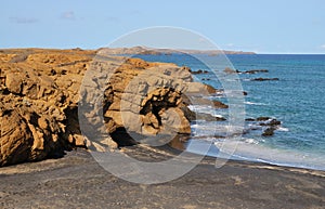 Boulder on beach corner