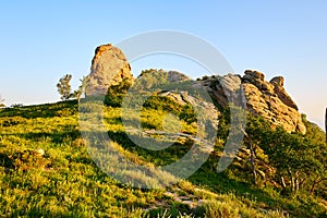 The boulder moorstone on the mountain sunset