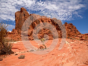 Boulder of red rocks with blue sky and clouds on the valley of fire state park