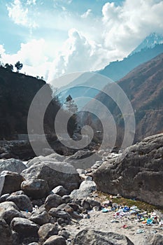 Boulder Rocks in the foreground of Himalayan Mountain Valley. Nature background. Vertical Image