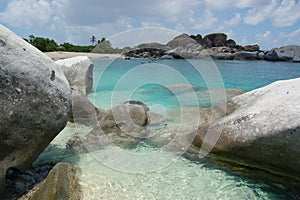 Boulders, beach and azure waters