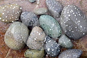 Boulders eroded by sea waves on a beach