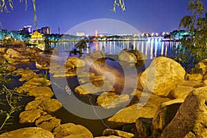 The boulders in lake water at night