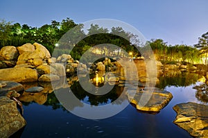 The boulders and  lake water at night