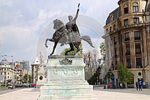 Boulevard with statue in Bucarest photo