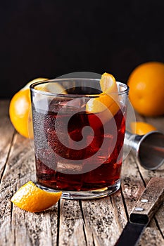 Boulevardier cocktail in glass on wooden table