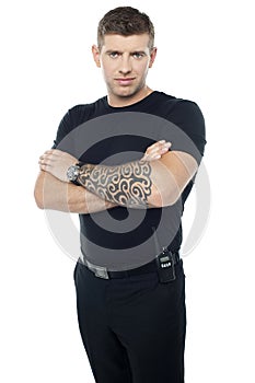 Bouncer with walkie-talkie. Tattoo on hands