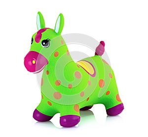 Bouncing inflatable horse toy for kids isolated on white background with shadow reflection. Rubber pony animal plaything.