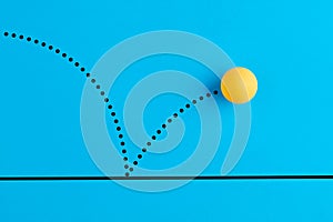 Bouncing table tennis ball is on blue background