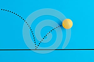 Bouncing table tennis ball is on blue background