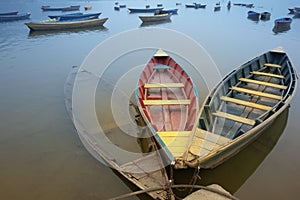 Bound boats in contrary colors photo