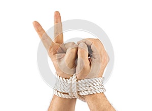 Bound hands and victory sign