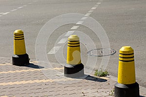 Boundary posts on the sidewalk