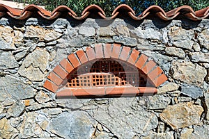 Boundary wall with small brick window - Liguria Italy