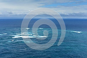 Boundary where the Tasman Sea meets the Pacific Ocean at Cape Reinga in New Zealand