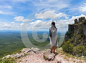 Boundless expanse. view from mountains. Person girl standing on top. Chiquitania. Bolivia