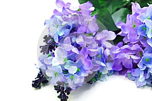 Bouquet of artificial blue purple on white background, home and wedding decor