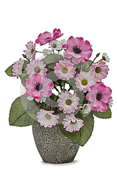 Bouquet of artificial flowers in a ceramic vase isolated on a white background