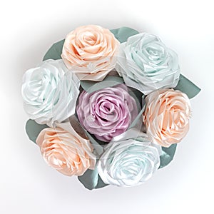 Bouquet, basket of flowers kanzashi from satin ribbons. Japanese traditional handmade decorations, pastel colors