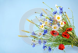 Bouquet of beautiful flowers Cornflowers, chamomiles wheat and