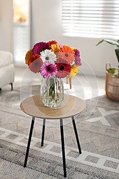 Bouquet of beautiful gerbera flowers on table at home