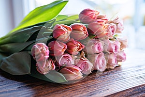 Bouquet of beautiful pink roses and tulips