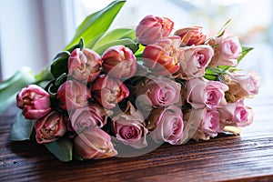 Bouquet of beautiful pink roses and tulips