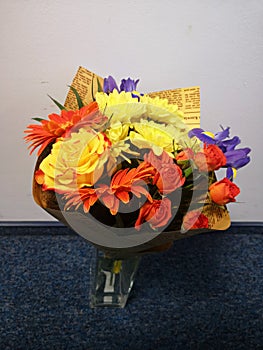 Bouquet of beautiful yellow, orange and violet flowers