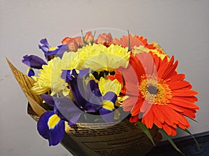 Bouquet of beautiful yellow, orange and violet flowers