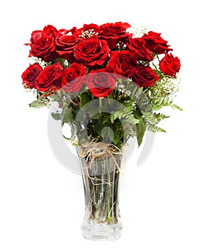 Bouquet of blossoming dark red roses in vase