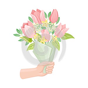 Bouquet of Blossoming Flowers with Tulips in Craft Paper Wrapping Clutched in Hand Vector Illustration