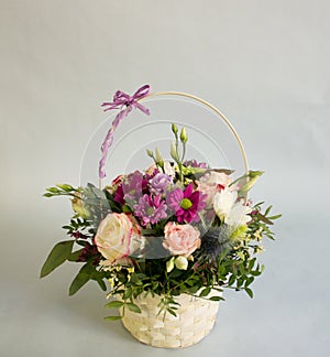 Bouquet of bright flowers in basket